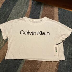 Brand new with tags Calvin Klein crop top. Cute rolled shoulder